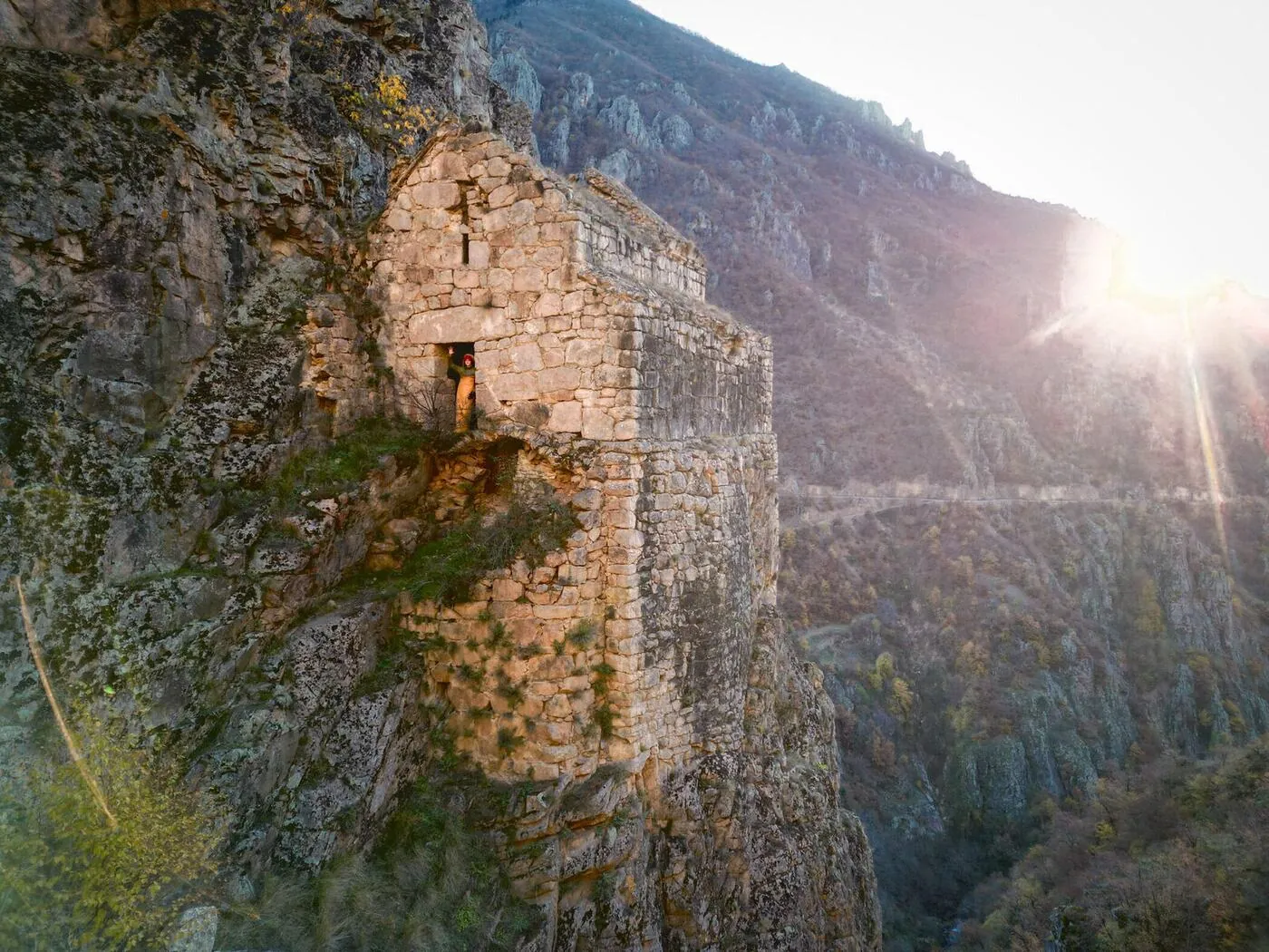 First light on the east wall of Nuka Sakdari, the valley falling away to the right and the sun rising over the ridge.